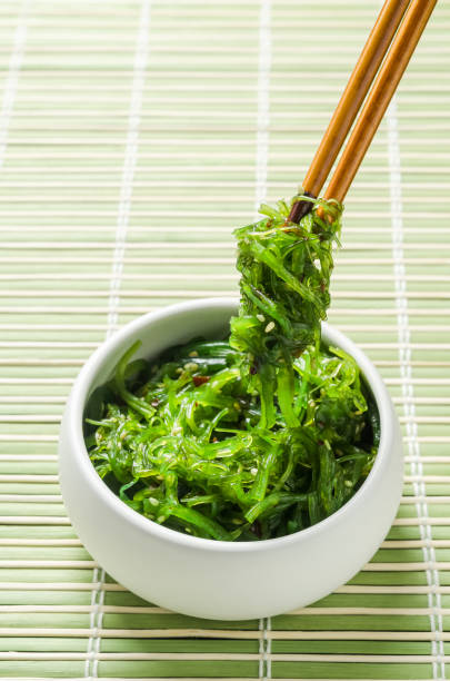 istock Spicy Seaweed Salad with chopsticks on bamboo background. 901240130