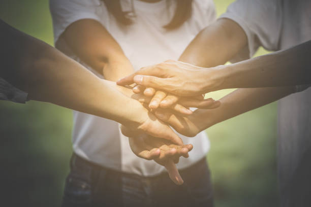 istock Hands of teenagers teamwork 901243866