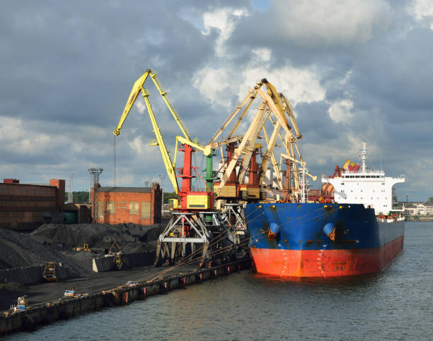 istock Large bulker ship loading coal in Ventspils free port 901252354