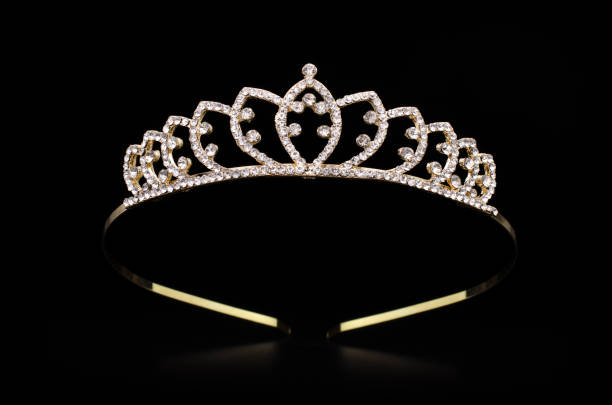 istock golden tiara with gems isolated on black background 901257964