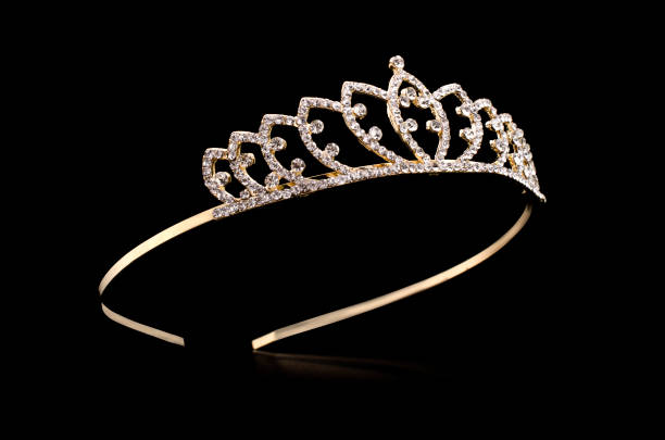 istock golden tiara with gems isolated on black background 901257970