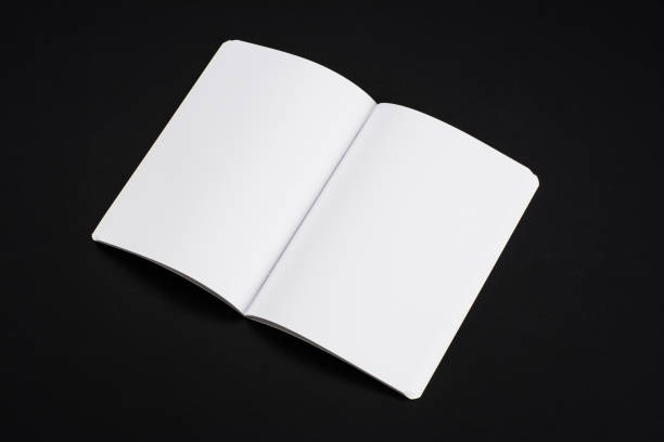 istock Mock-up magazines, book or catalog on black table background. 901260888