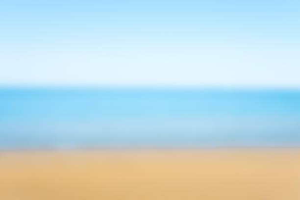 istock sea sand and blue sky blurred for background 901261462