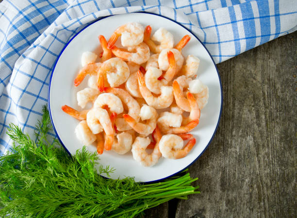 istock frozen shrimps on wooden surface 901261488