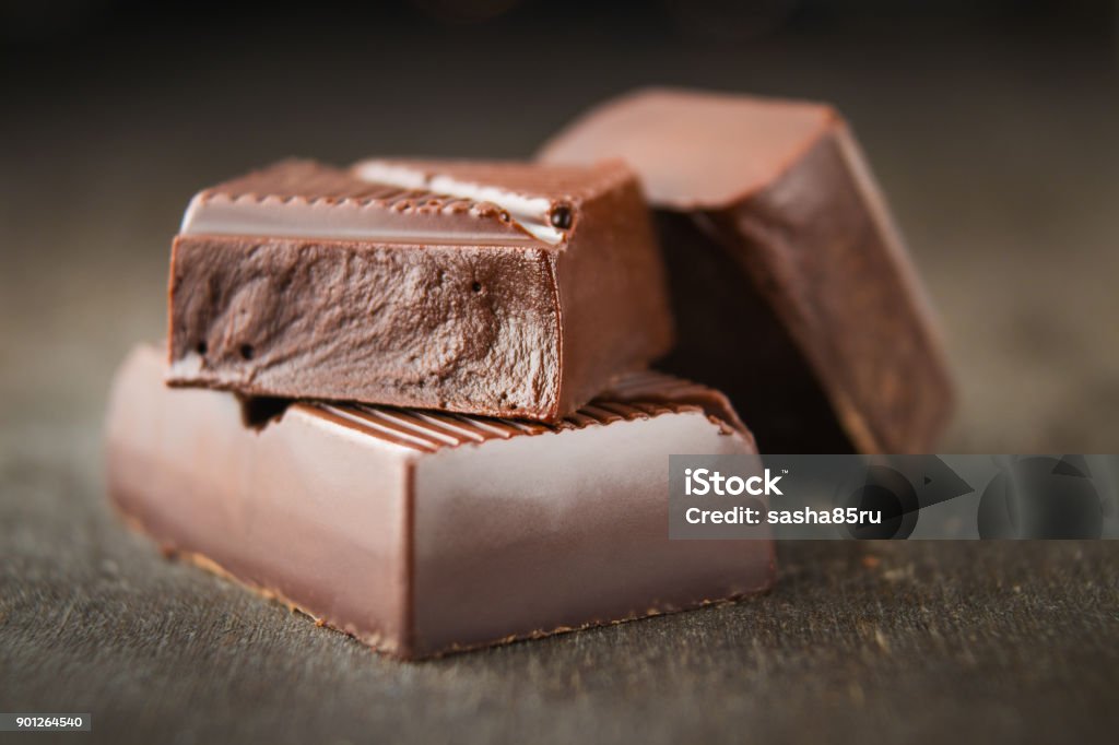 Chocolate bars on a wooden background. Milk Chocolate Stock Photo