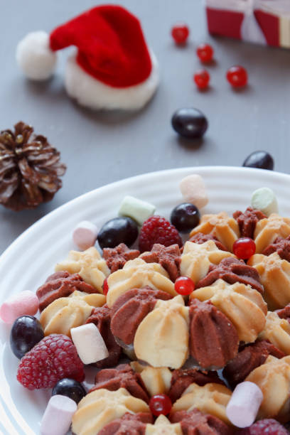 istock Christmas still life with cake with fresh berries on white plate. Selective focus 901265978