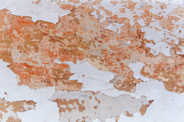 istock Grunge texture facade with red and yellow paint and rough structure 901269818