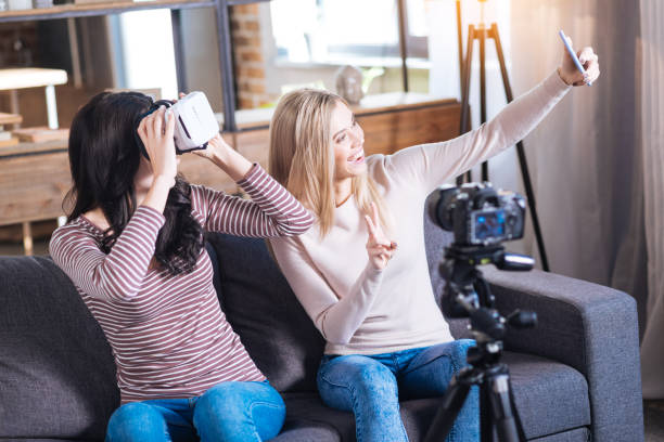 istock Happy young woman taking a selfie 901270066