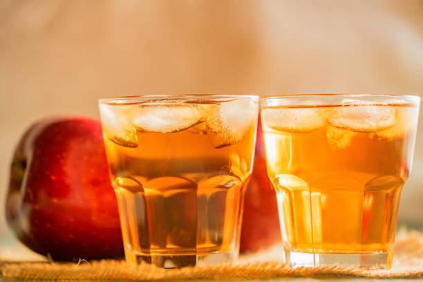 istock Fresh apple juice or cider in glasses on table 901273676