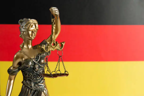 Lady justice and German flag.