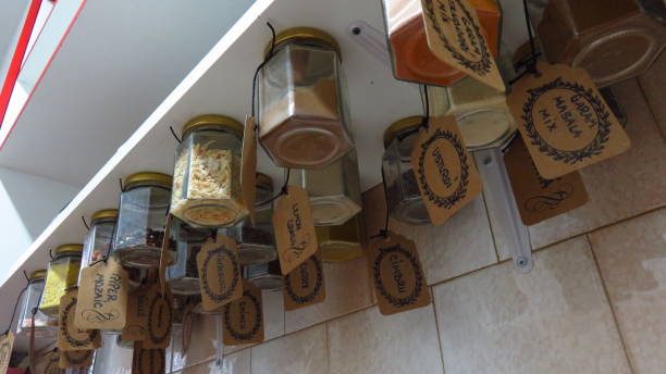 istock Creative Display of Herbs and Spices Hanging From Shelf 901280430