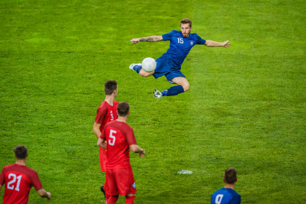 istock Soccer player performing a volley shot 901280990