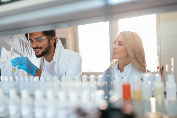 istock Group of students working at the laboratory 901283452