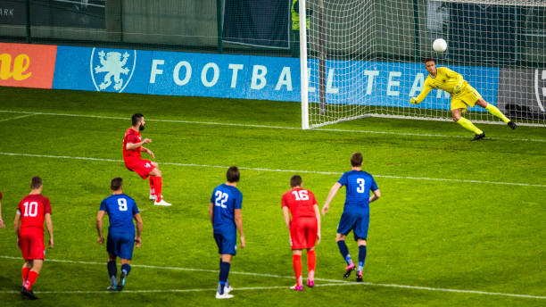 istock Soccer player shooting penalty 901284580