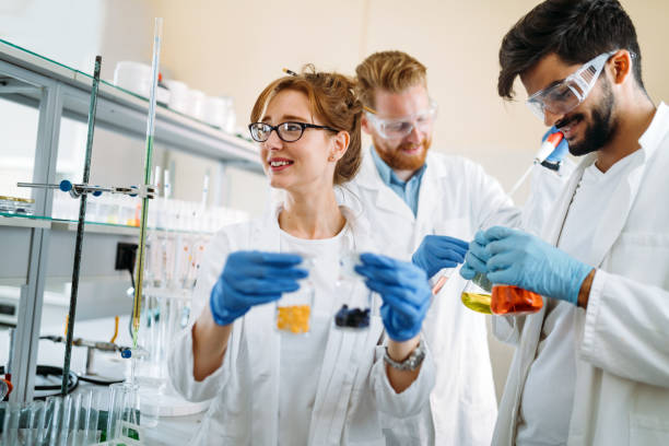 istock Group of students working at the laboratory 901284690