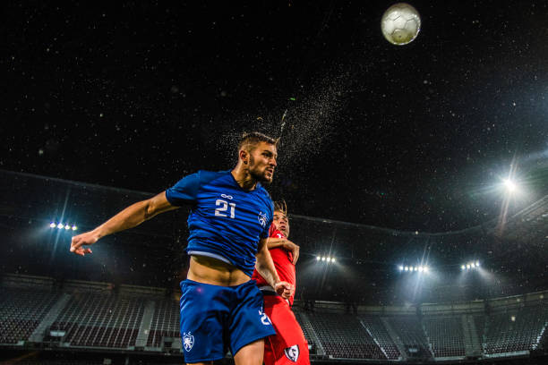istock Soccer player heading the ball 901284736