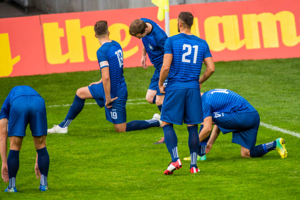 istock Soccer players warming up 901285006