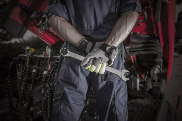 Semi Truck Pro Mechanic Semi Truck Pro Mechanic. Caucasian Service Worker with Heavy Duty Wrench Preparing For Complicated Truck Fix. engine failure stock pictures, royalty-free photos & images