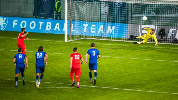 istock Soccer player shooting penalty 901285552