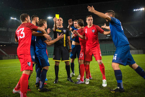 istock Soccer referee showing yellow card 901288486