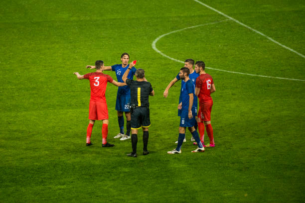 istock Soccer referee showing red card 901288954