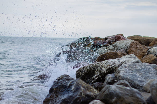 istock Wave crushing into a rock mole in Croatia 901291290