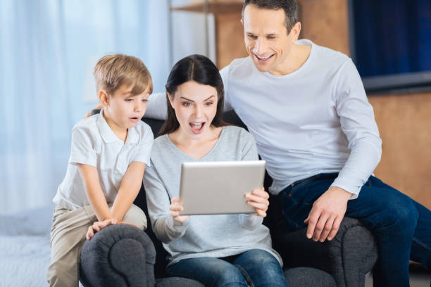 istock Young family being surprised by the video 901296330