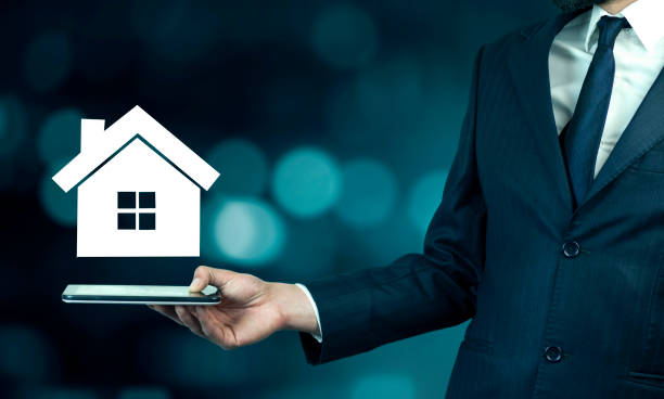 istock man hand phone and house 901297336