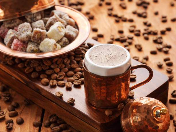 Fresh Turkish coffee and Turkish delight on wooden background