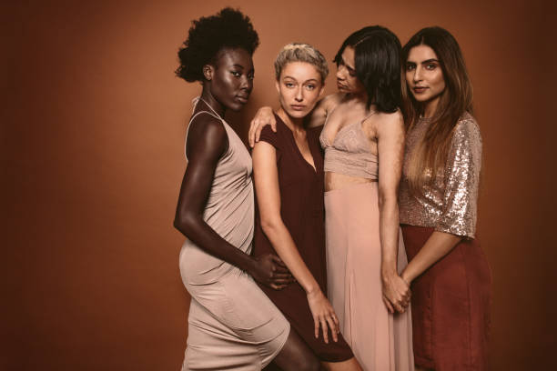 istock Beautiful young women standing together 901312646