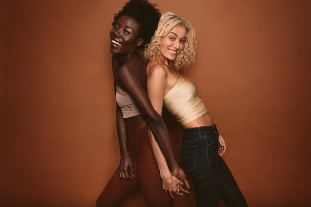 Diverse women standing together and smiling