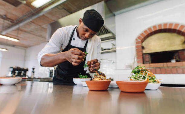 istock Chef cooking food at commercial kitchen 901315452