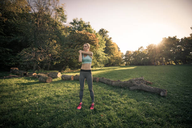 istock Woman stretching in nature after jogging 901317894