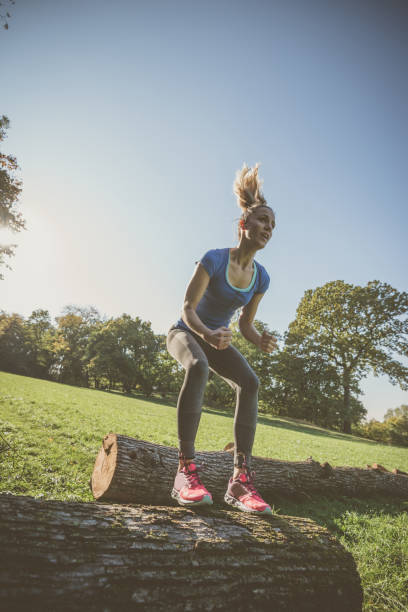 istock Healthy woman jumping and crouching during efficient strength training 901319834