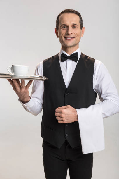 istock Gorgeous male waiter serving tea 901327098