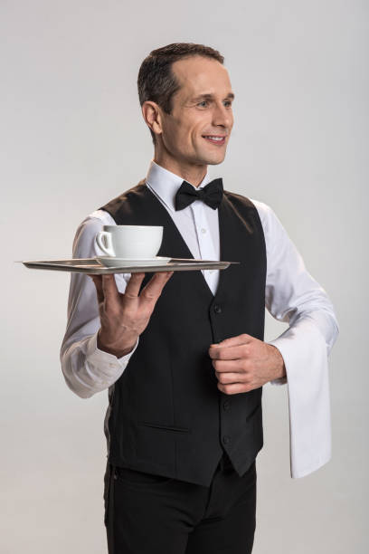 istock Happy male waiter catering drink 901327122