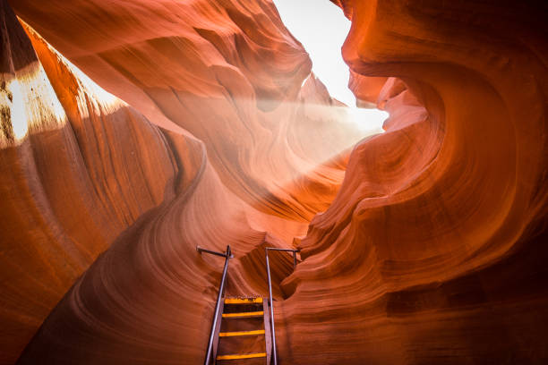 Antelope Canyon, Arizona, USA Beautiful view of amazing sandstone formations with a ladder leading toward a magic light beam in famous Antelope Canyon near the historic town of Page at Lake Powell, American Southwest, Arizona, USA lower antelope stock pictures, royalty-free photos & images