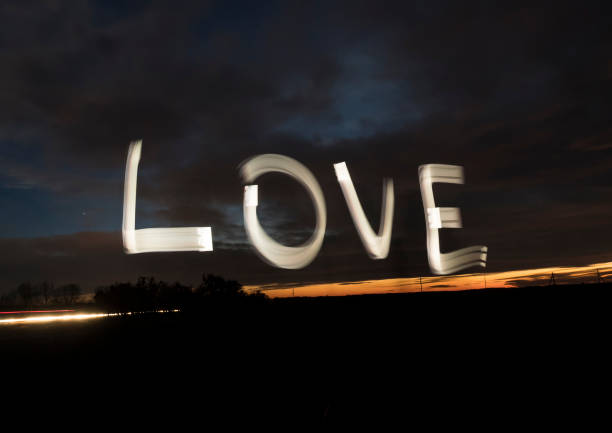 istock Love word light painting night sky 901334354