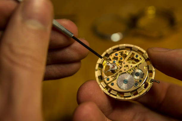 istock watch maker is repairing a vintage automatic watch. 901337814