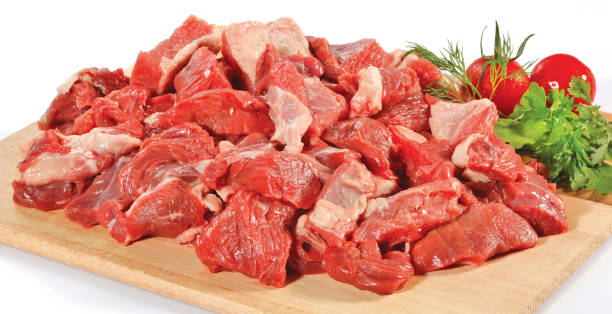 istock fresh raw red cubed meat chunk on wooden cut board isolated over white background 901343030