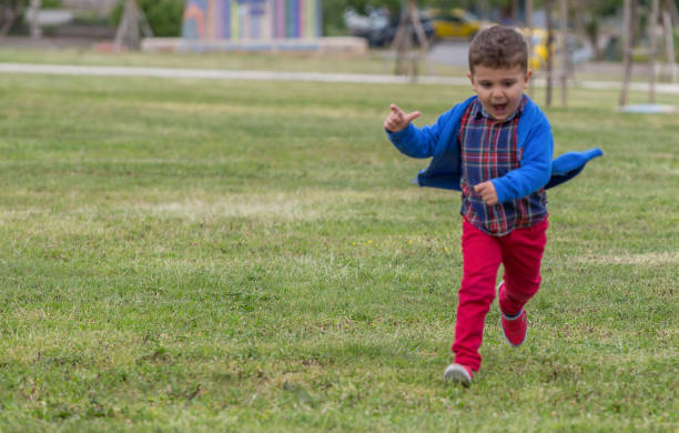 istock Happy boy running in front or back yard 901350440