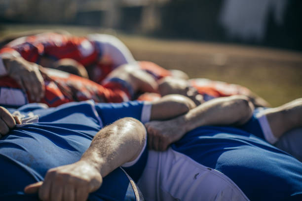 istock Rugby players embracing 901350672