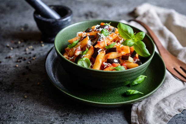 istock Traditional Italian Pasta alla Norma with eggplant, tomato, cheese and basil 901353946
