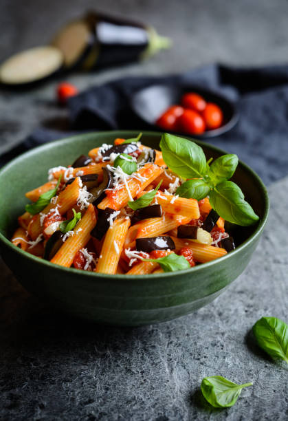 istock Traditional Italian Pasta alla Norma with eggplant, tomato, cheese and basil 901353994