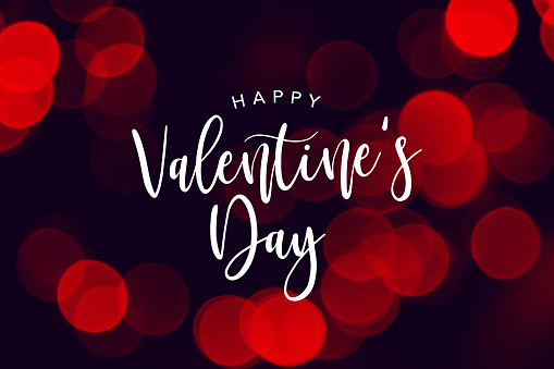 Feliz día de San Valentín de celebración texto sobre fondo de luces duotono rojo photo