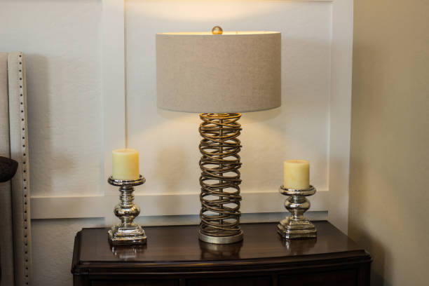 istock Modern Lamp & Candles On Bedroom Nightstand 901359224