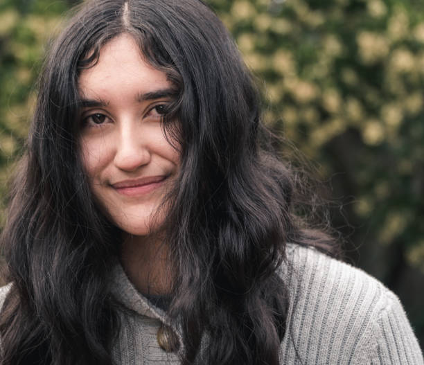 istock Young Latin Woman looking at Camera 901362394