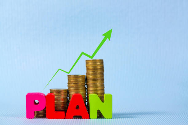 istock PLAN wooden text and step of coins stack with copy space for add text, financial and business planning concept. 901363362
