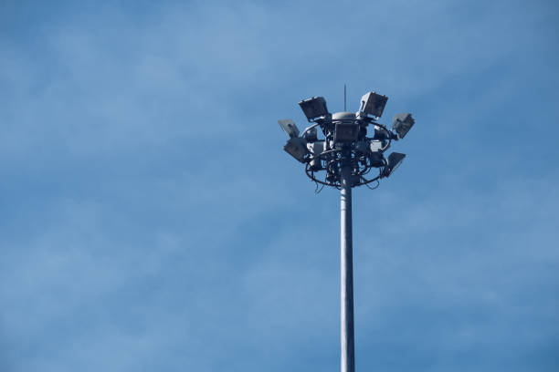 istock Lamp post electricity industry with blue sky. Spotlight tower. 901363474