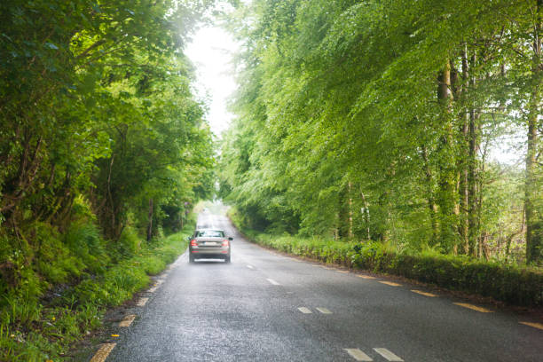 istock Car Driving on a Road in Rural Ireland 901366138